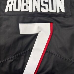 Black Jersey with White and Red Number 7